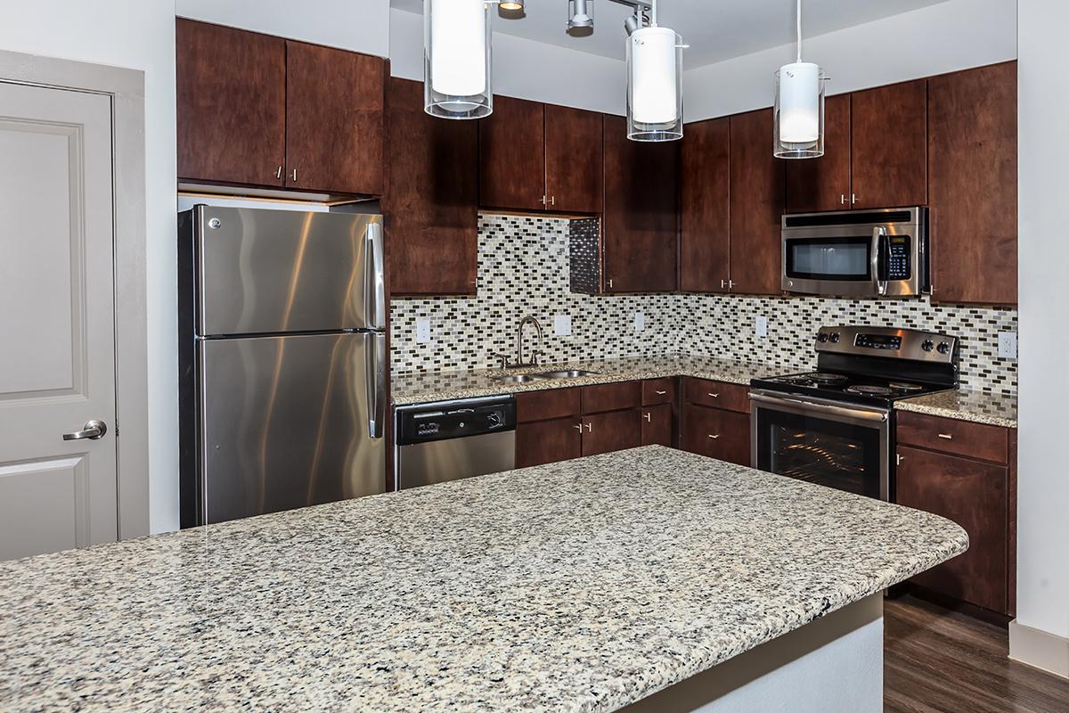 a modern kitchen with stainless steel appliances