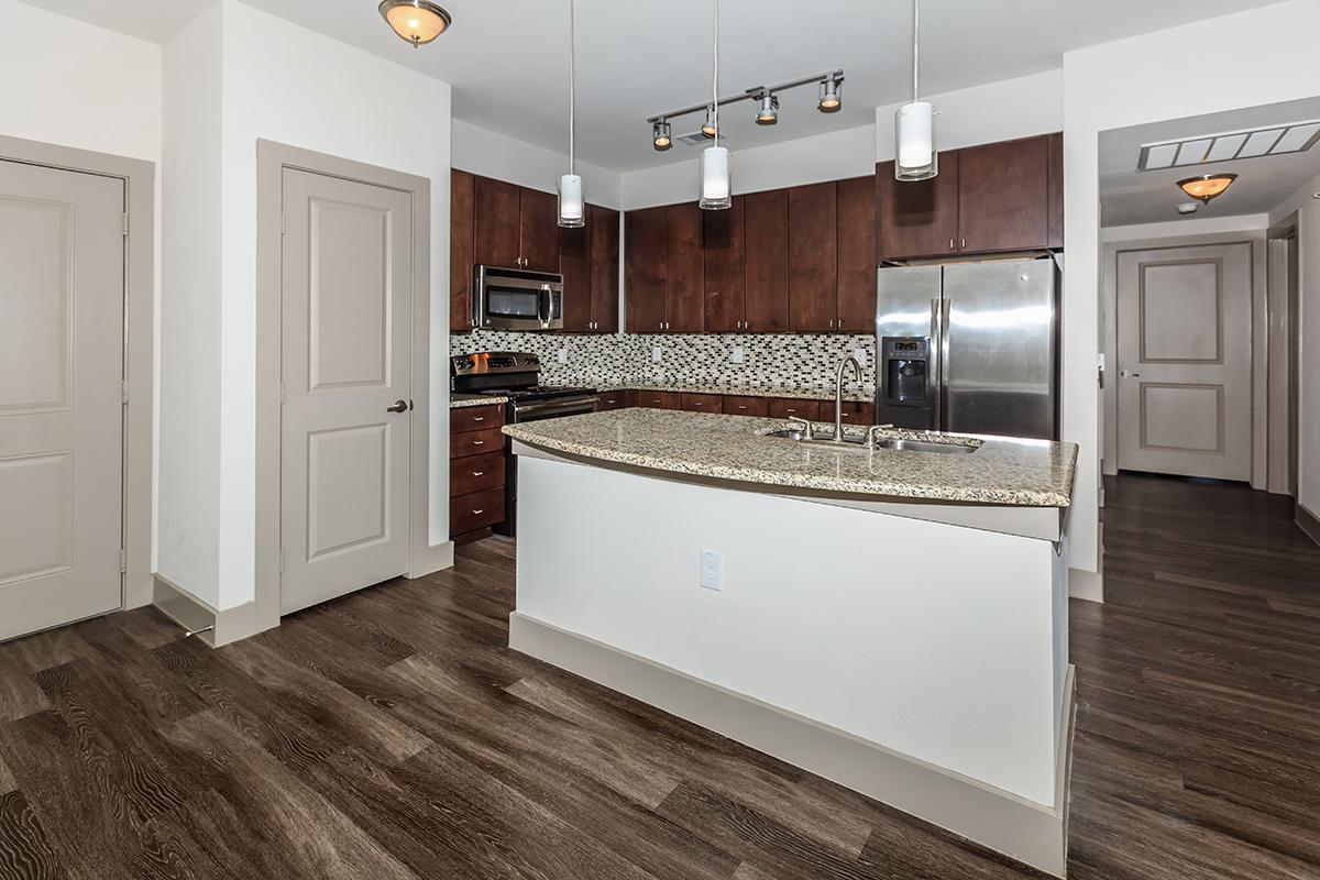 a kitchen with a wooden floor