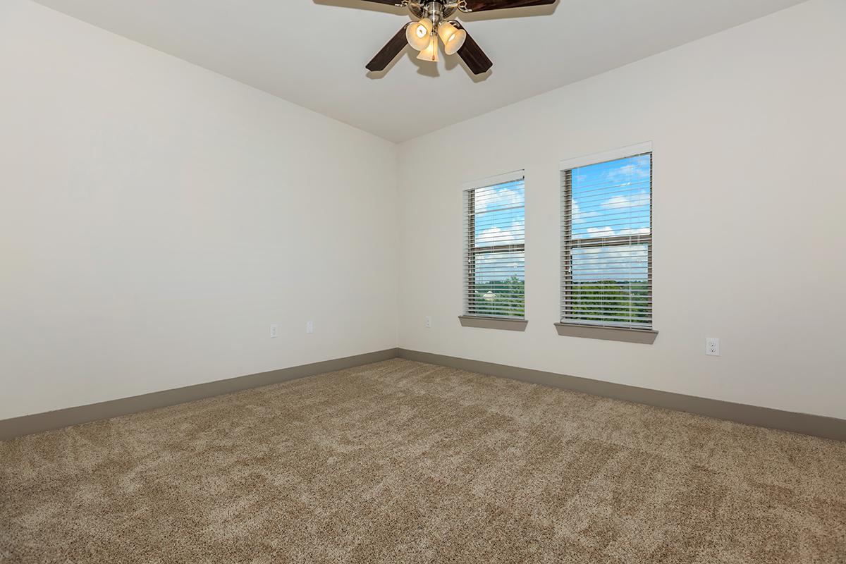 a bedroom with a large window