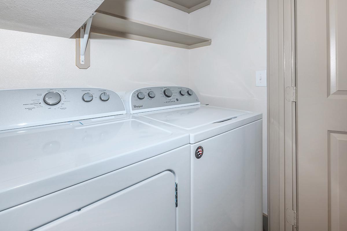 a white refrigerator freezer sitting inside of a kitchen