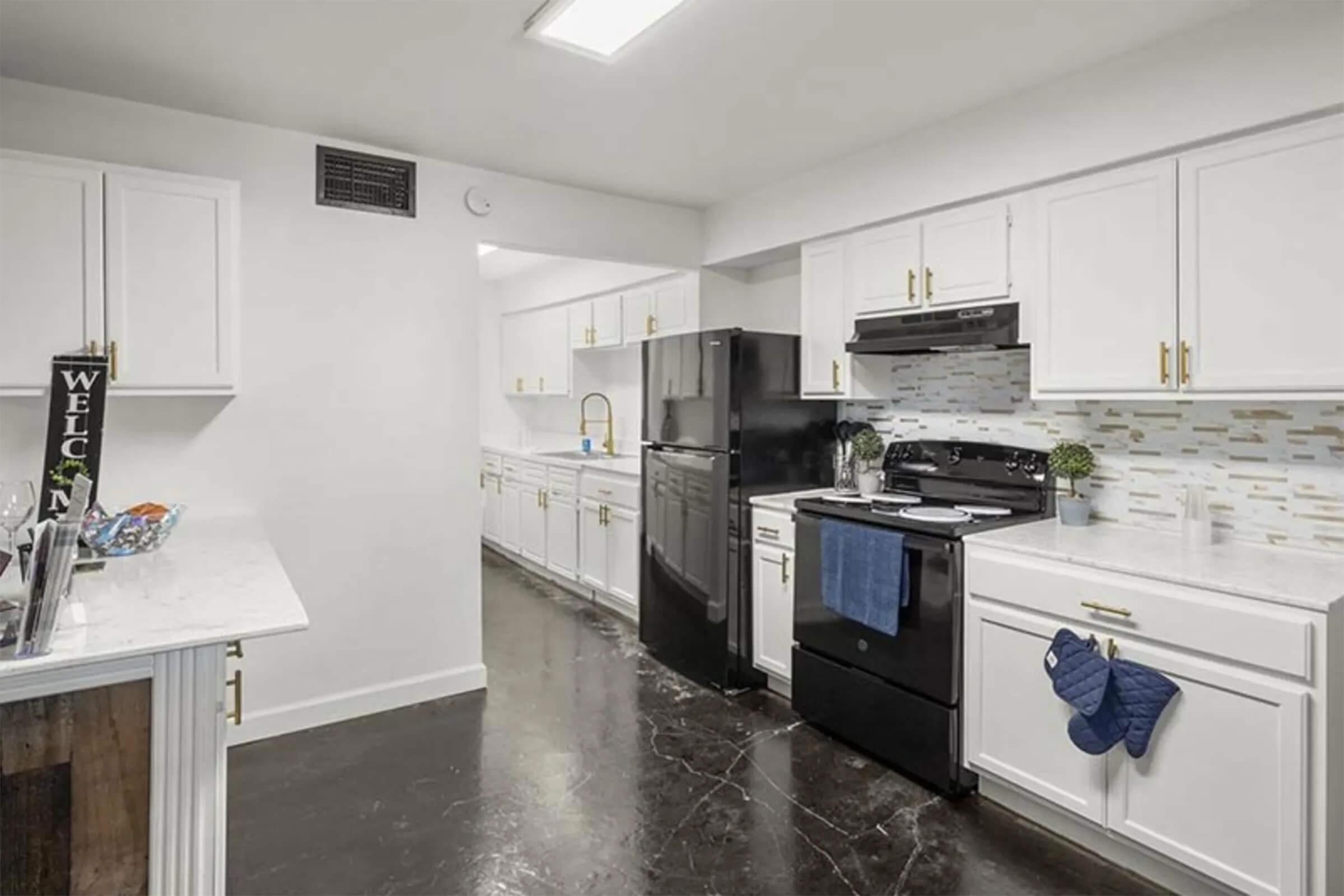 a kitchen with a stove and a refrigerator