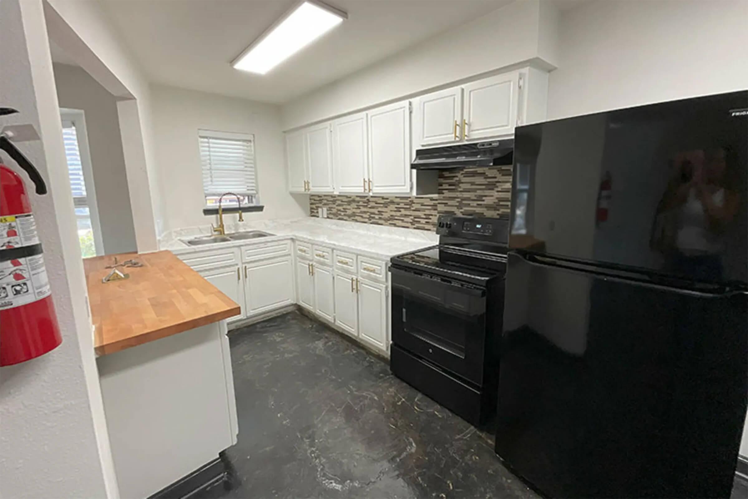 a kitchen with a sink and a stove