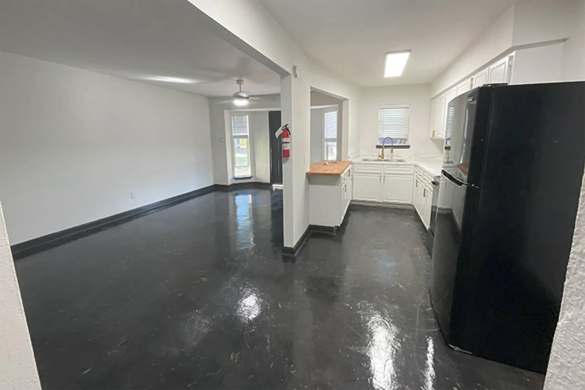 a kitchen with a tile floor