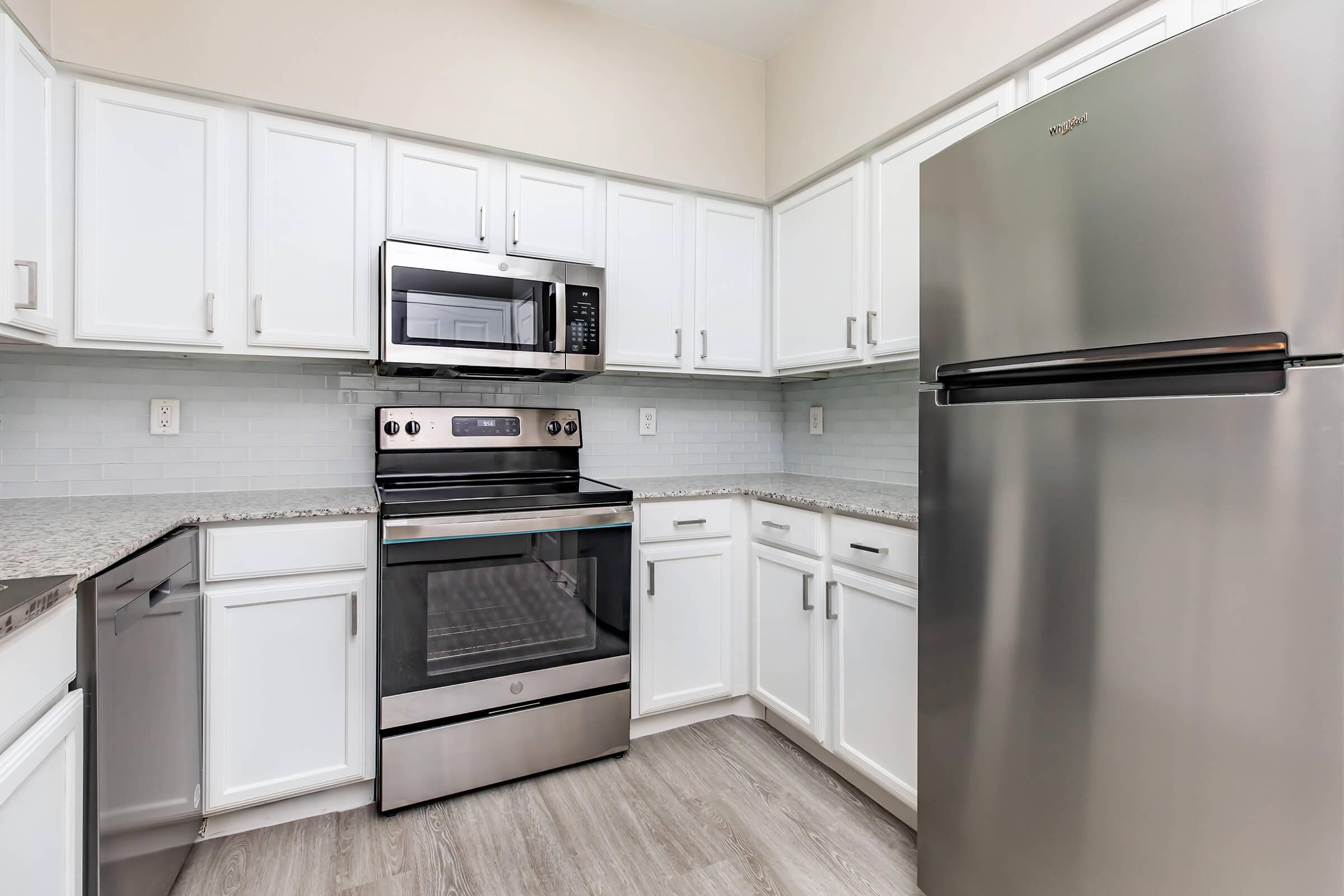 a kitchen with stainless steel appliances