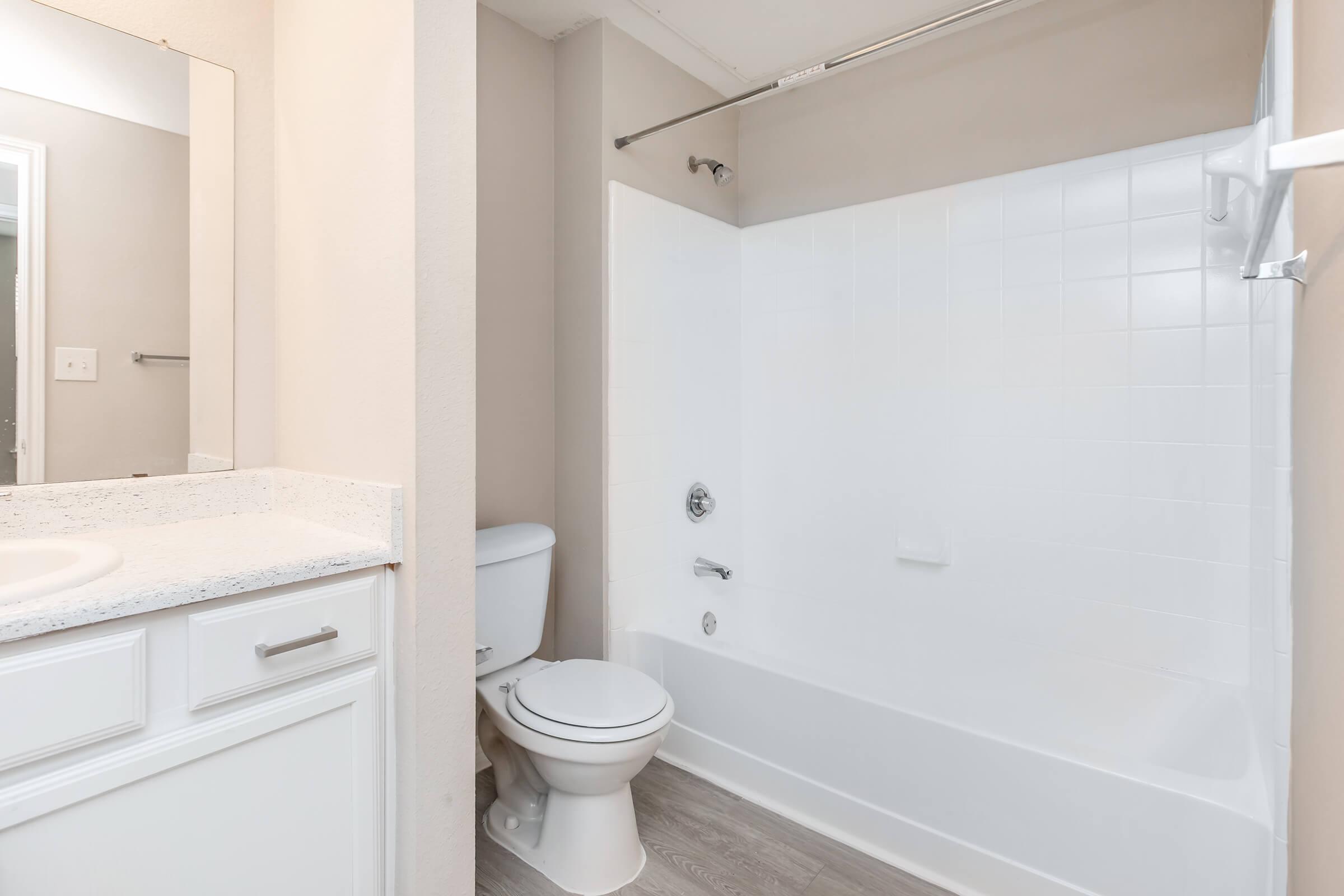 a room with a sink and a shower