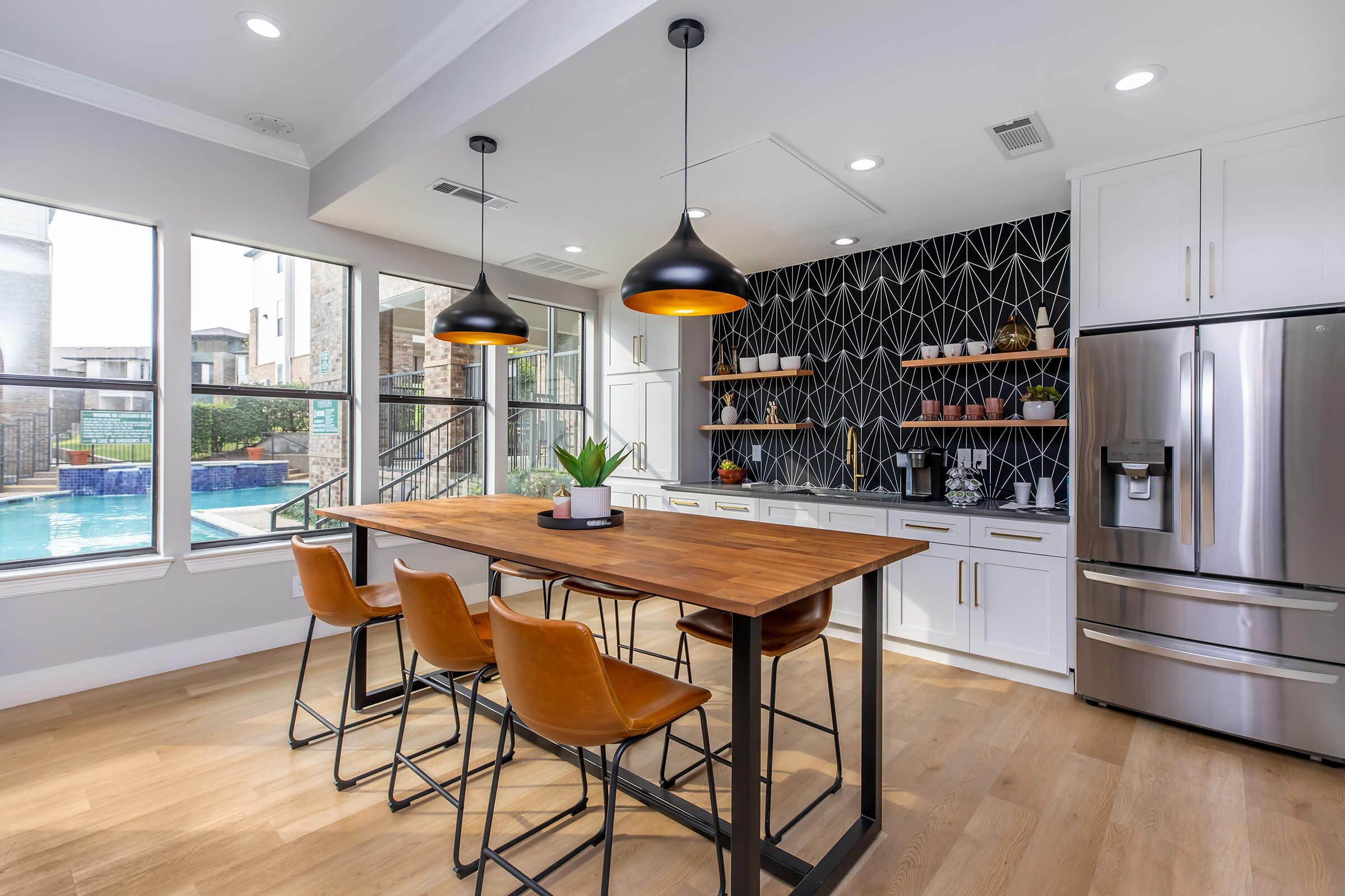 a kitchen with an island in the middle of a room