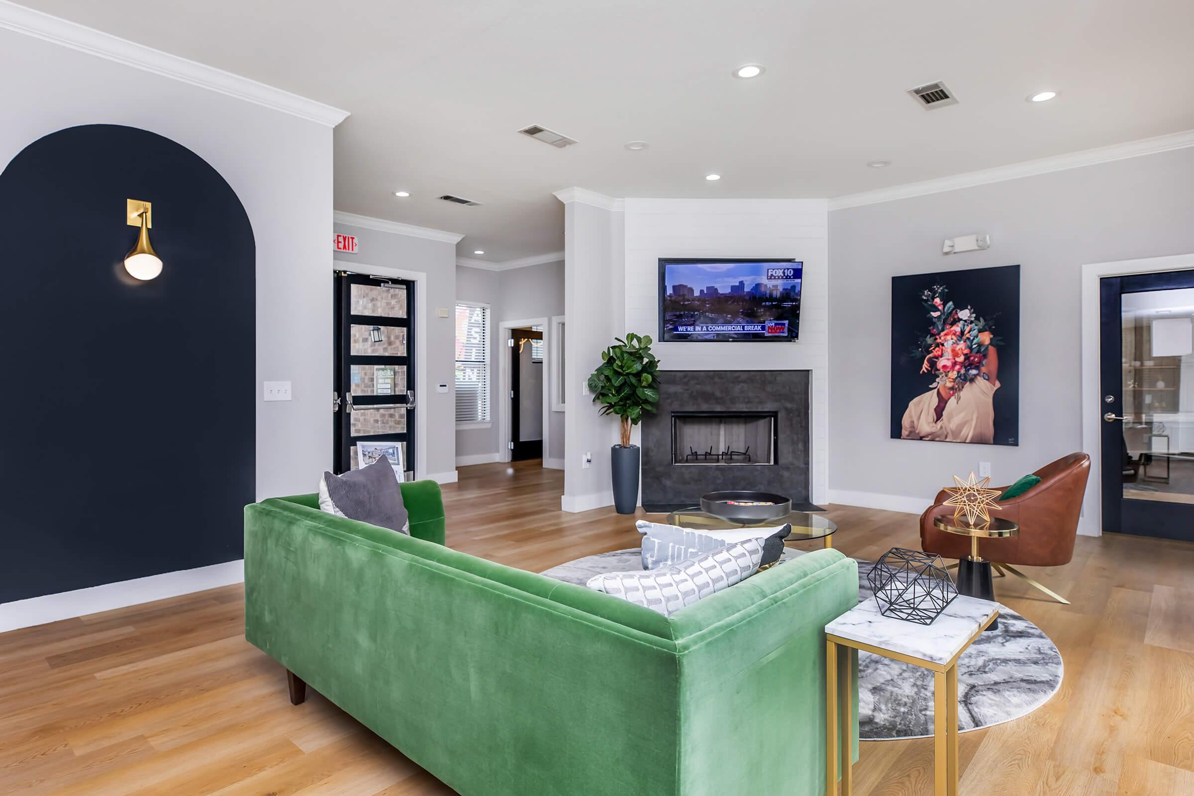 a living room filled with furniture and a flat screen tv