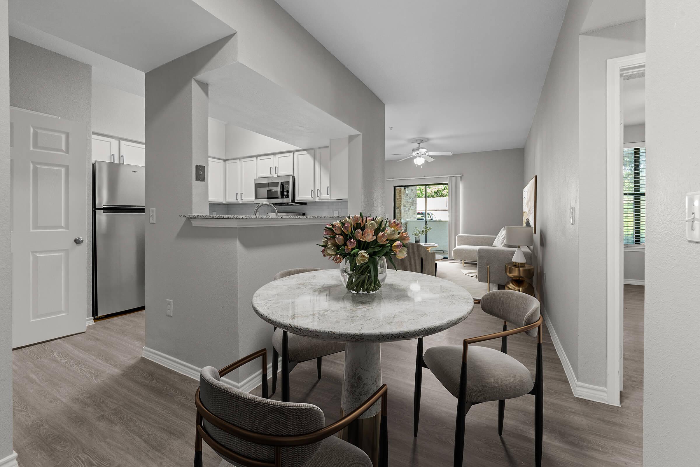 a kitchen with a table in a room