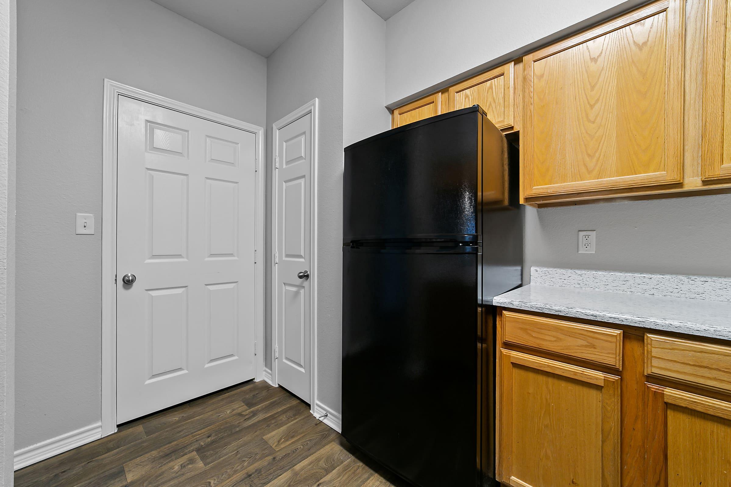 a stainless steel refrigerator in a kitchen