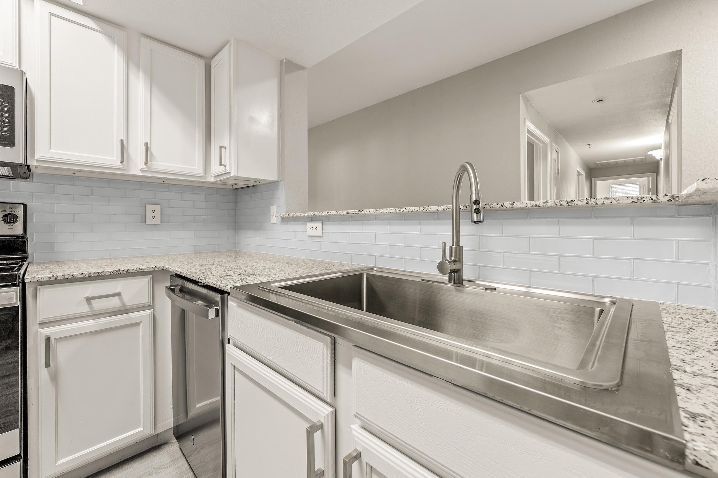 a kitchen with a stove and a sink