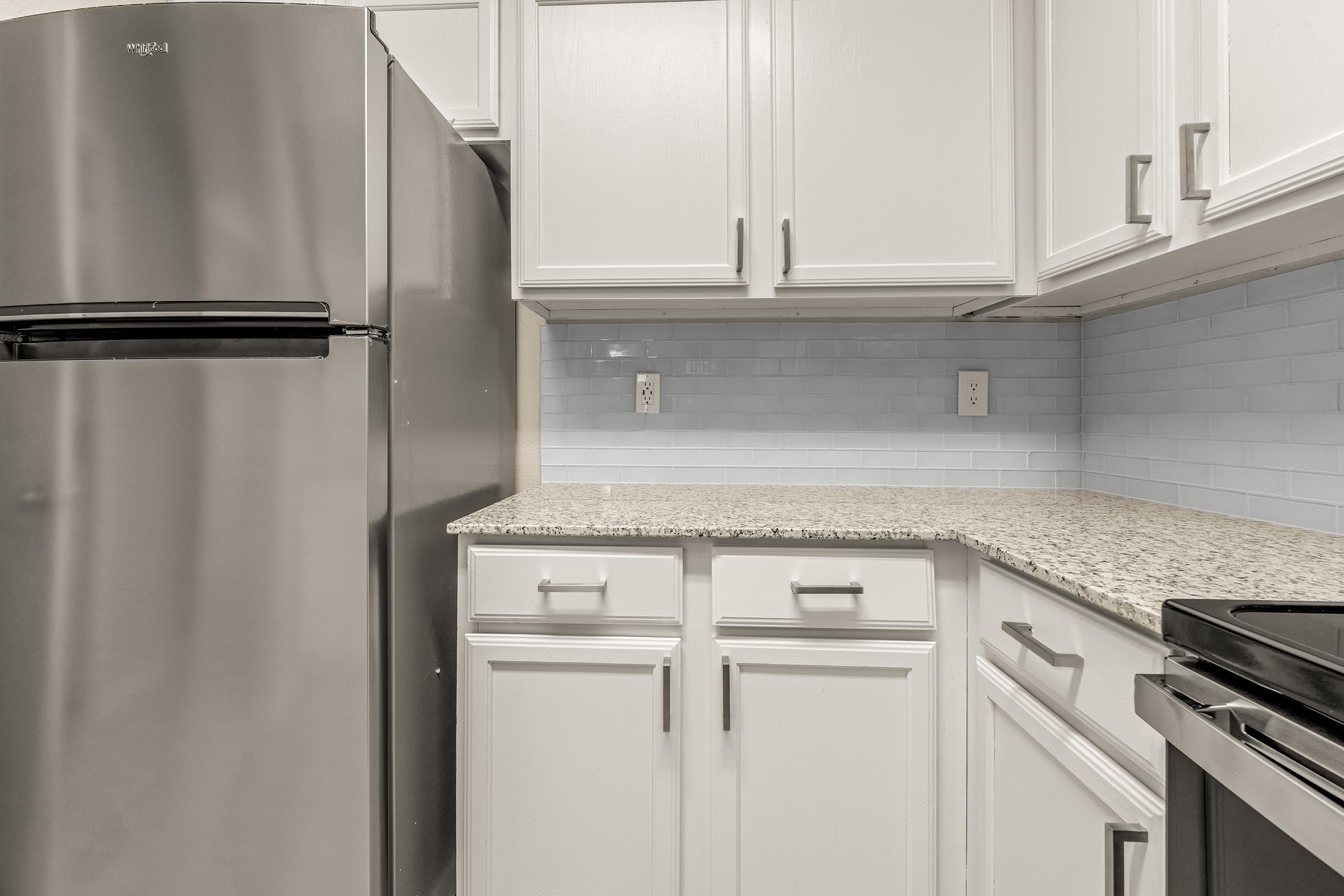 a kitchen with a stove top oven sitting inside of a refrigerator