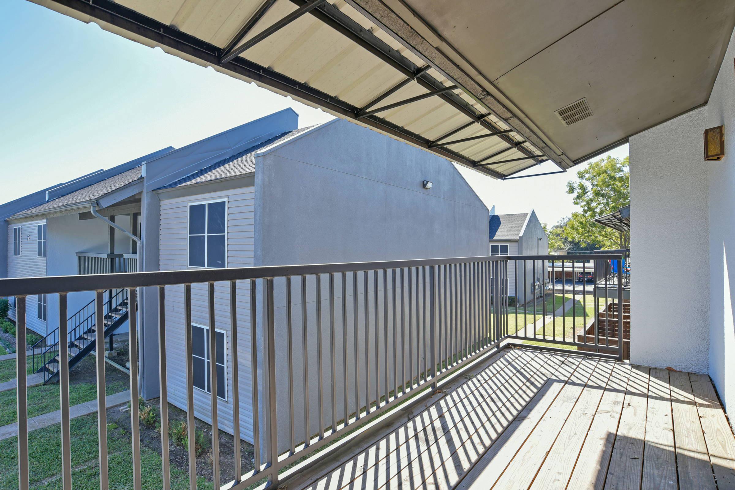 a building with a metal fence