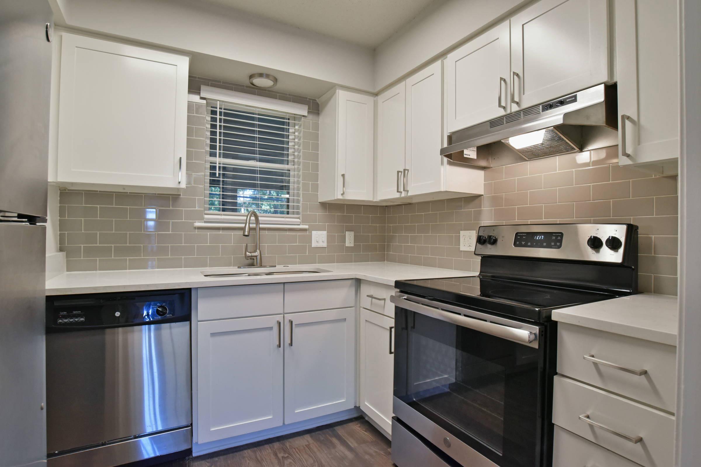 a kitchen with a stove top oven