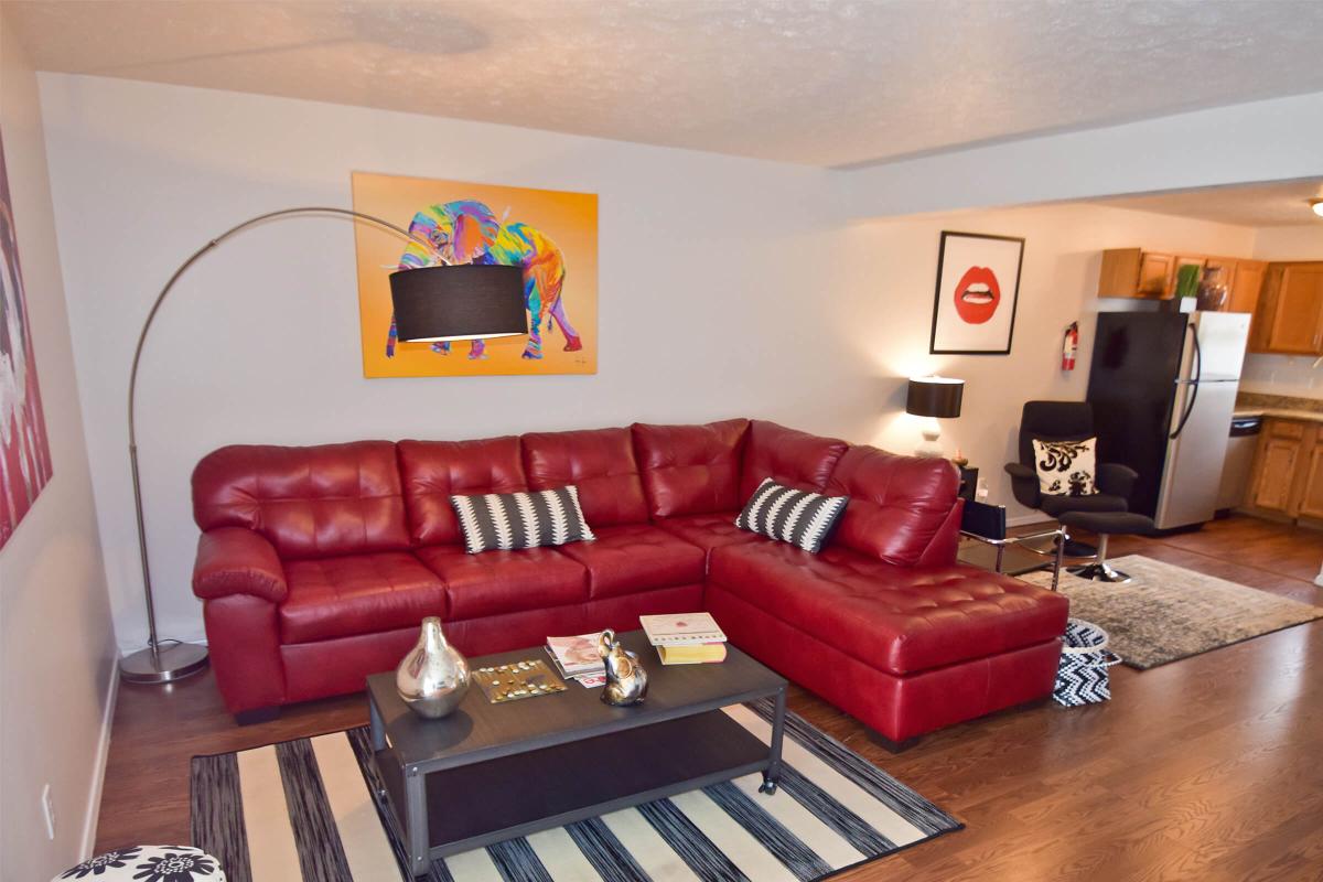 a living room filled with furniture and a flat screen tv