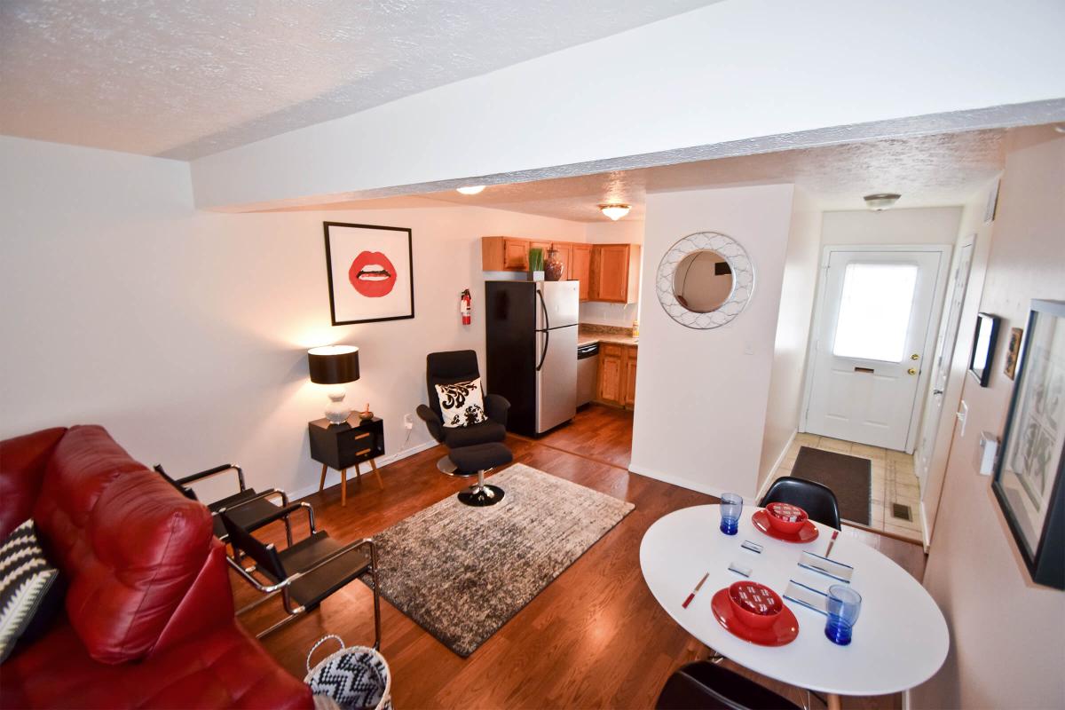 a living area with red and white furniture