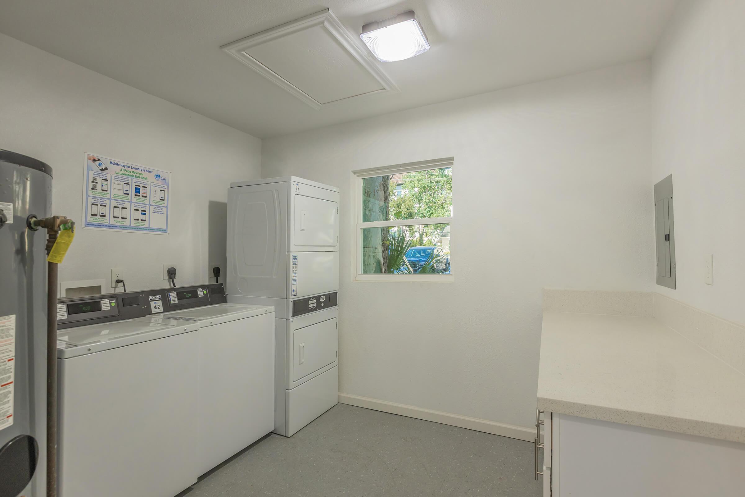 a kitchen with a sink and a refrigerator