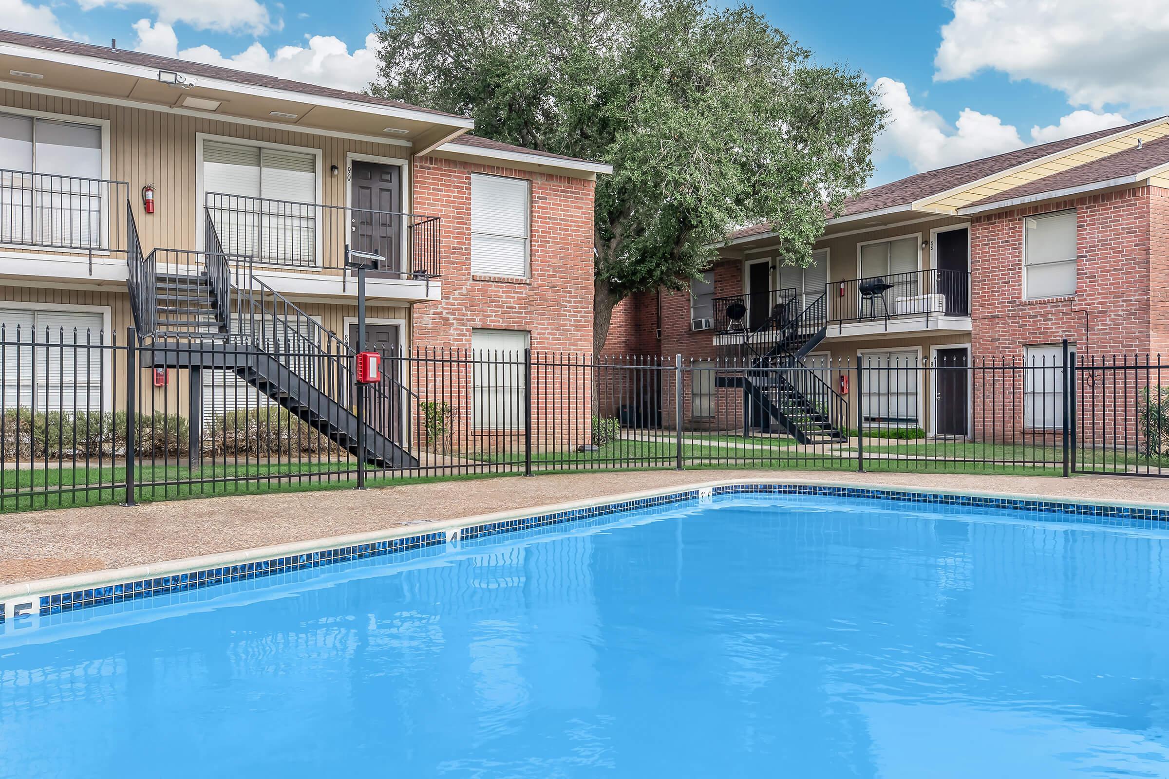 a large pool of water in front of a house