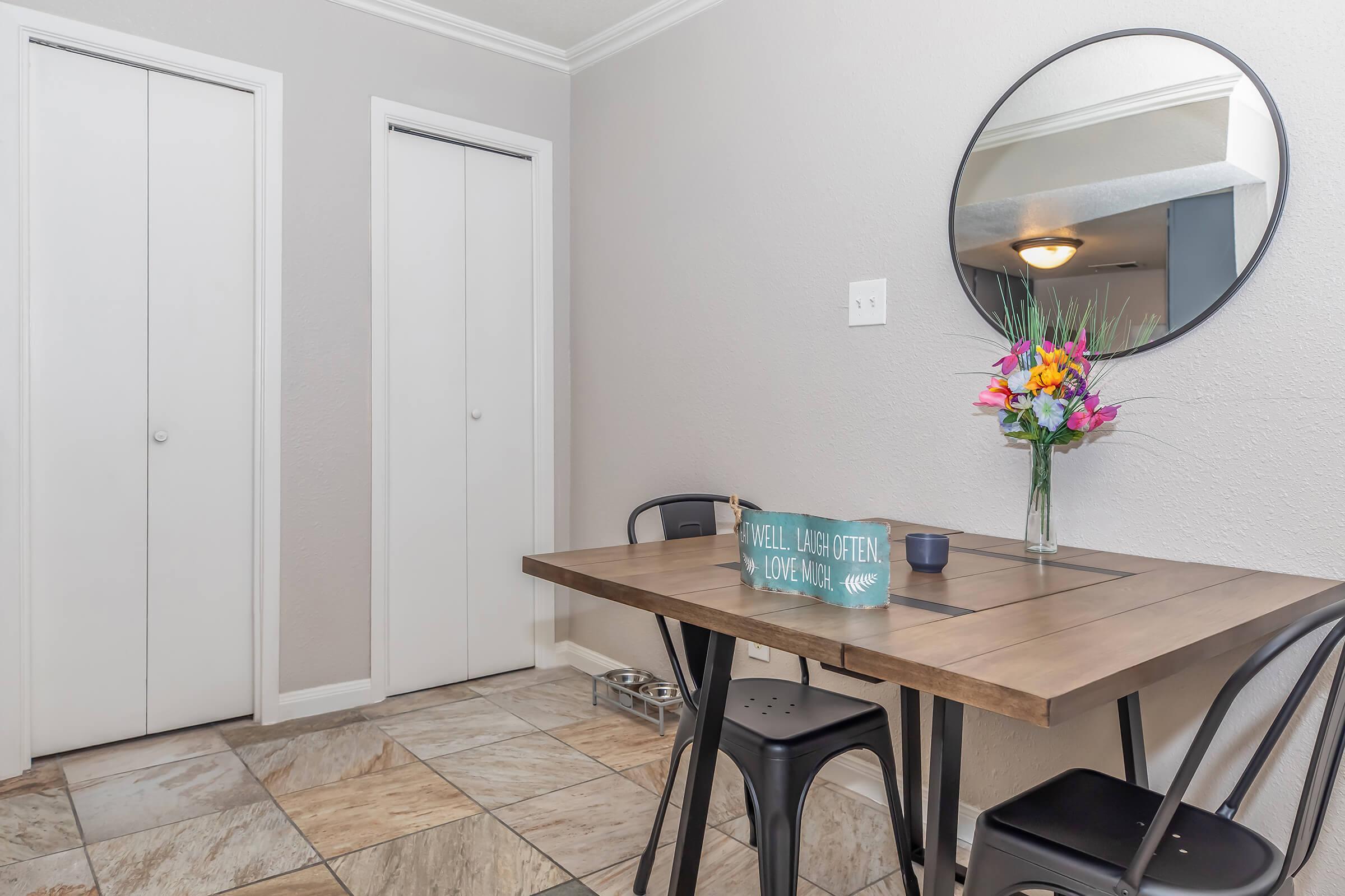 a chair sitting in front of a mirror