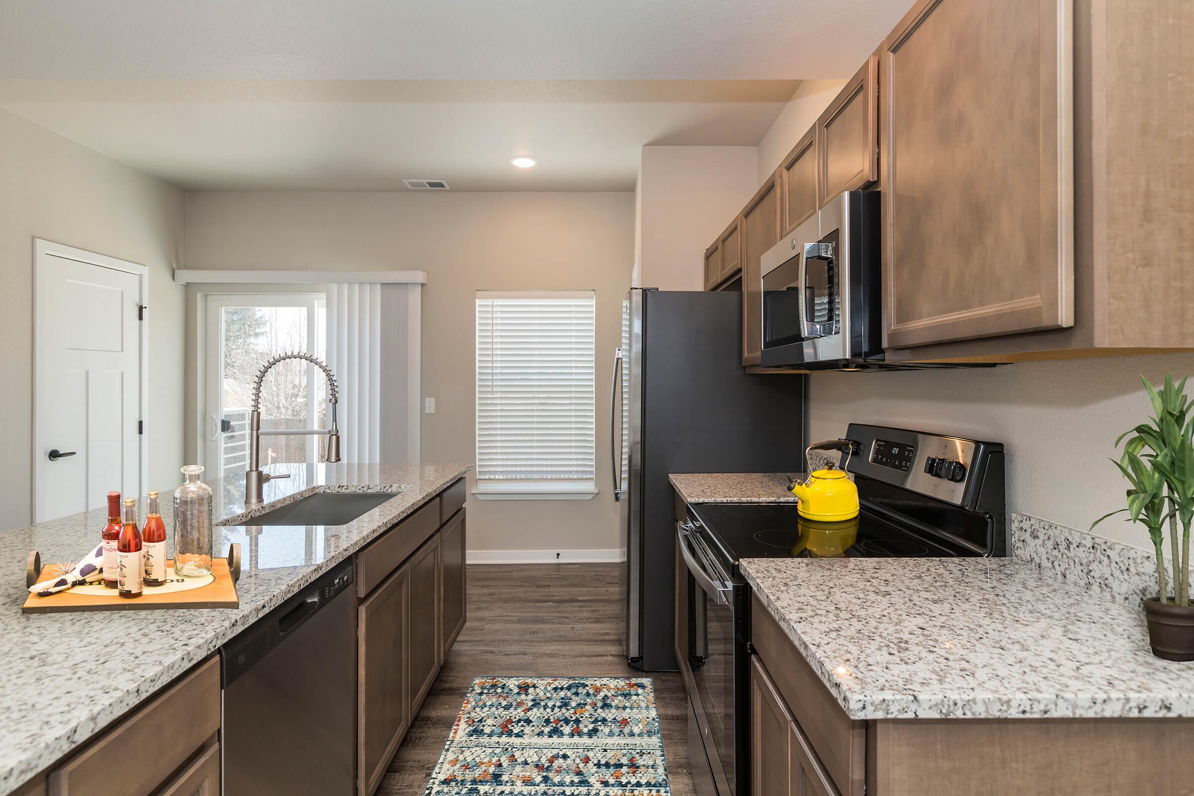 a modern kitchen with stainless steel appliances