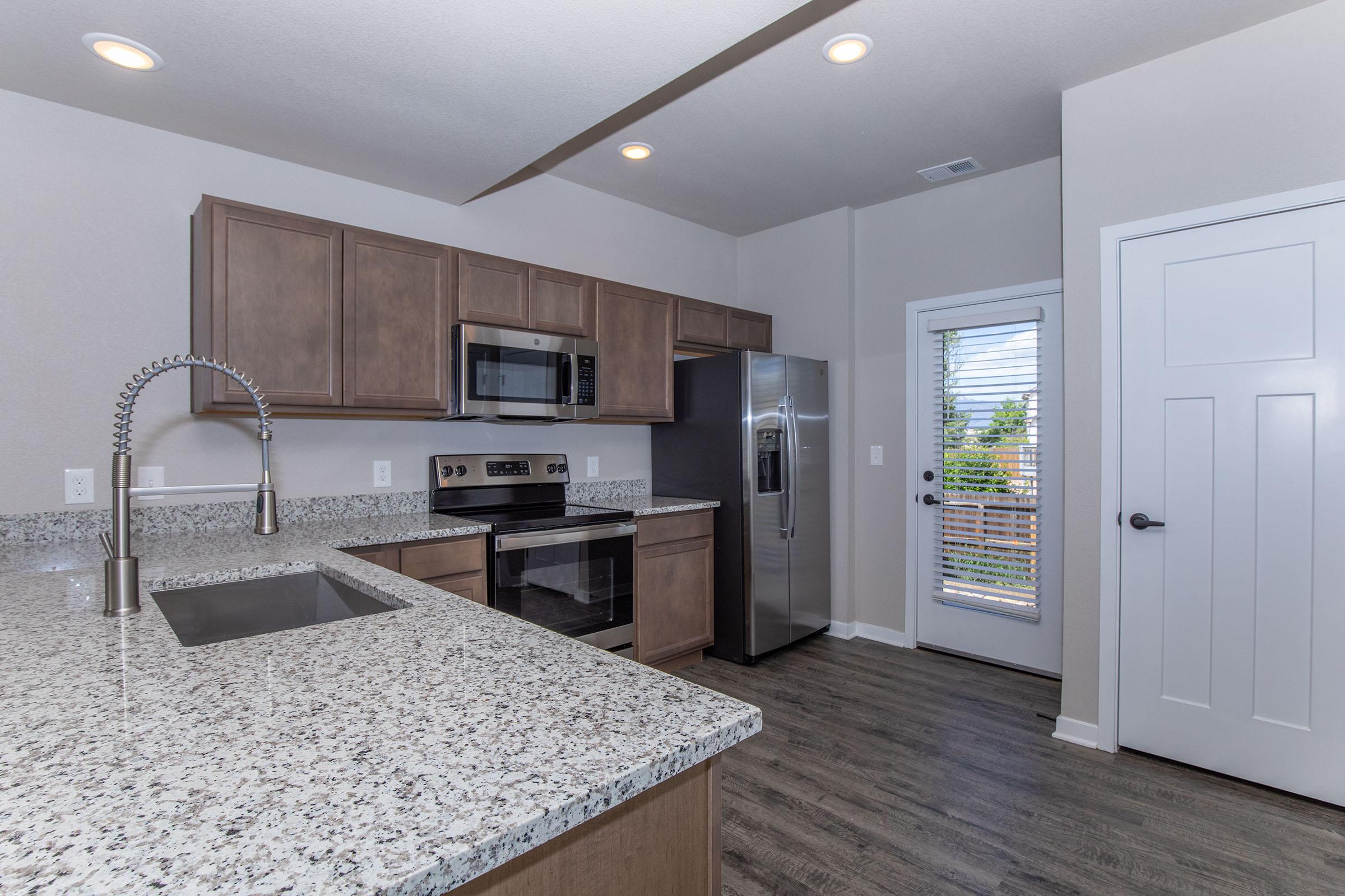 a modern kitchen with stainless steel appliances