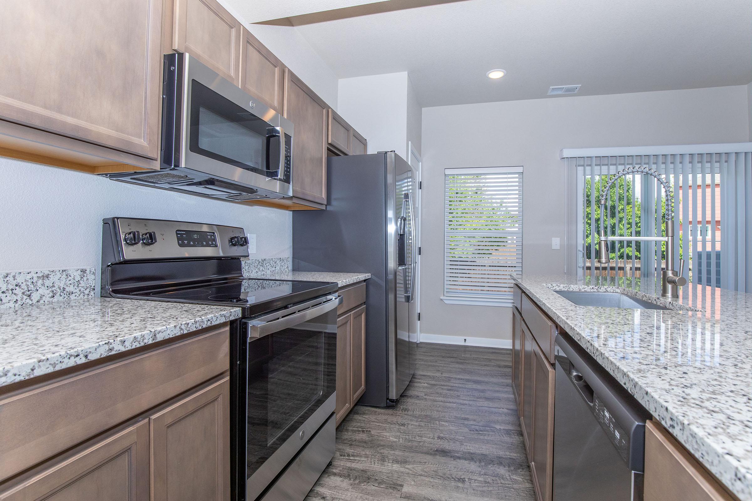 a modern kitchen with stainless steel appliances