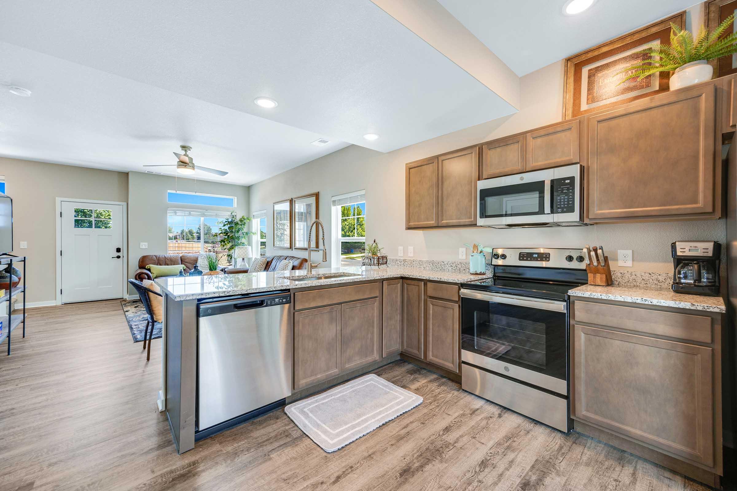 a kitchen with an island in the middle of a room