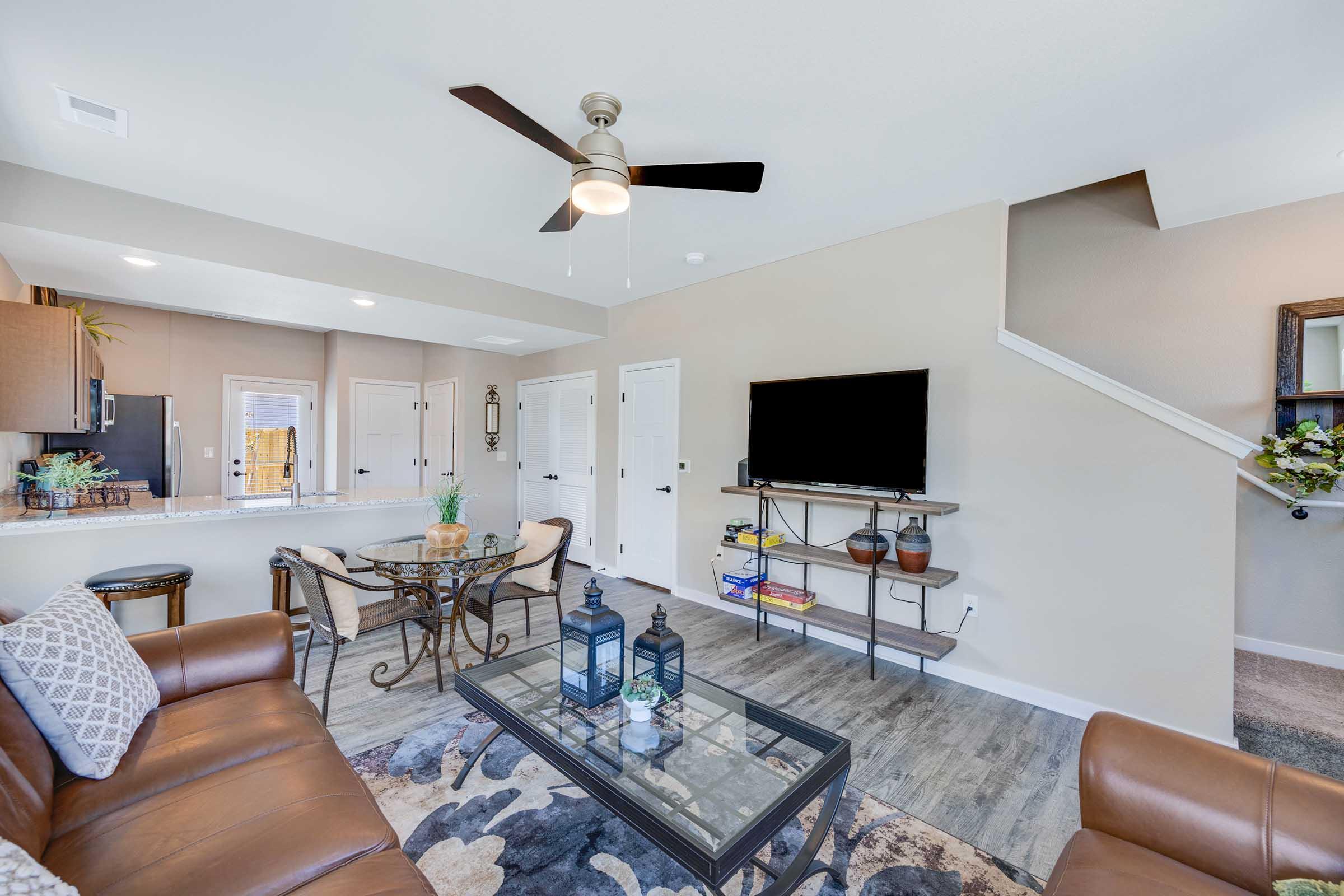 a living room filled with furniture and a fireplace