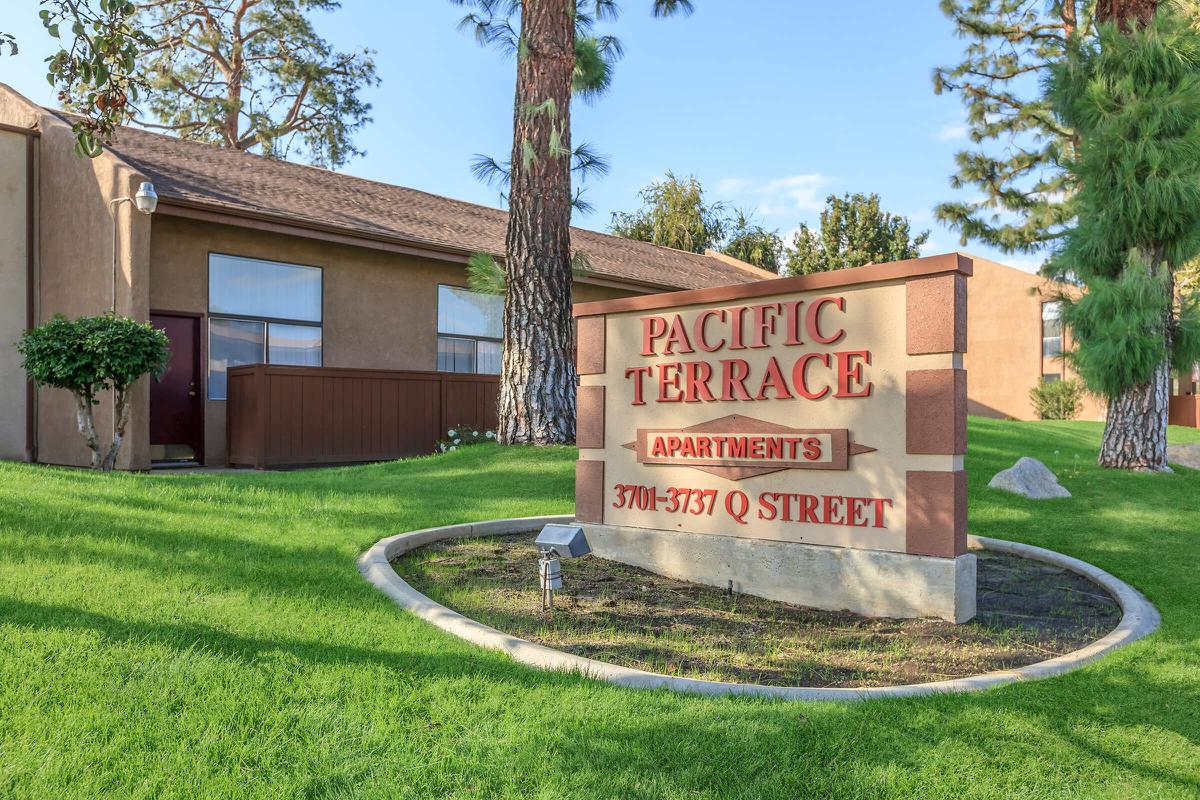 a sign in front of a house