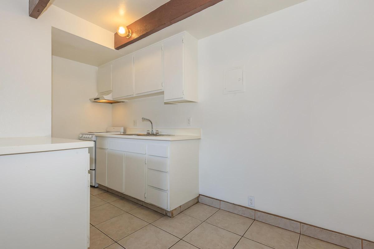 a white refrigerator freezer sitting inside of a kitchen