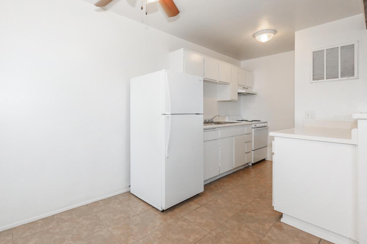 a large white refrigerator in a kitchen