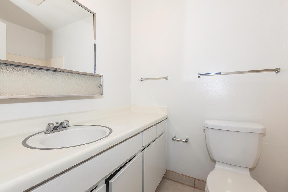 a small white sink in a bathroom