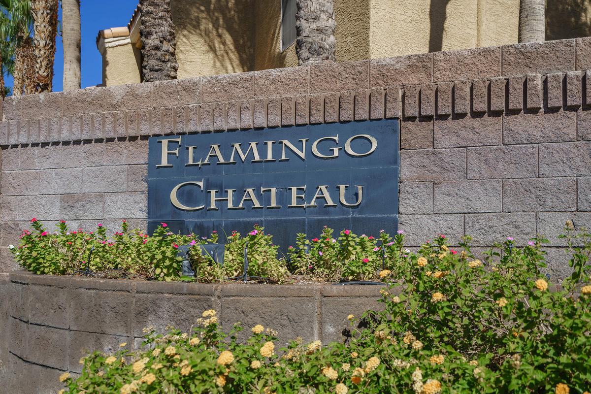 a stone building that has a sign on a brick wall