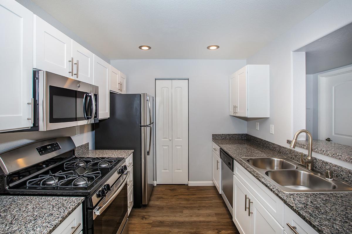 a modern kitchen with stainless steel appliances