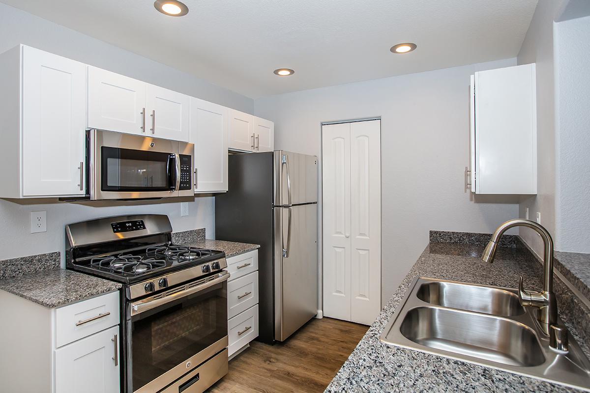 a modern kitchen with stainless steel appliances