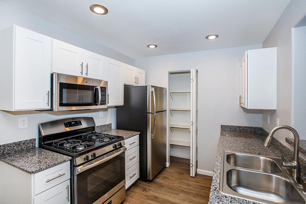 a modern kitchen with stainless steel appliances