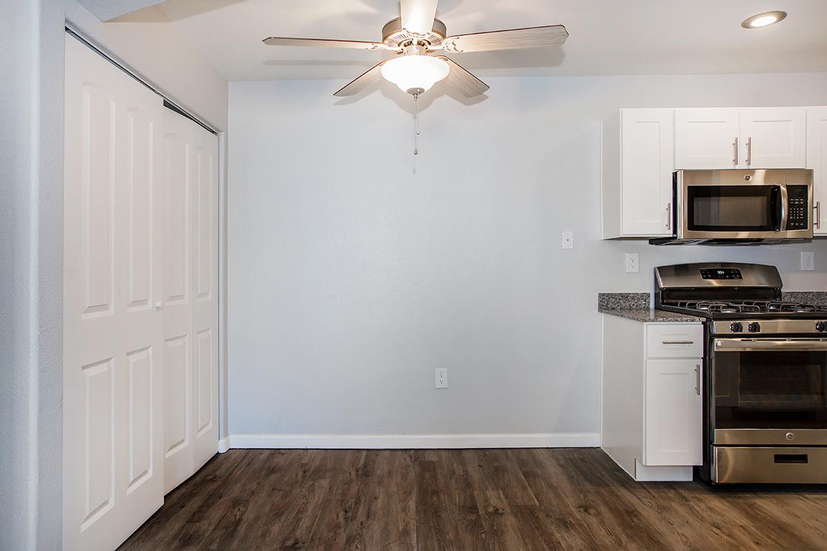 a kitchen with a stove and a refrigerator