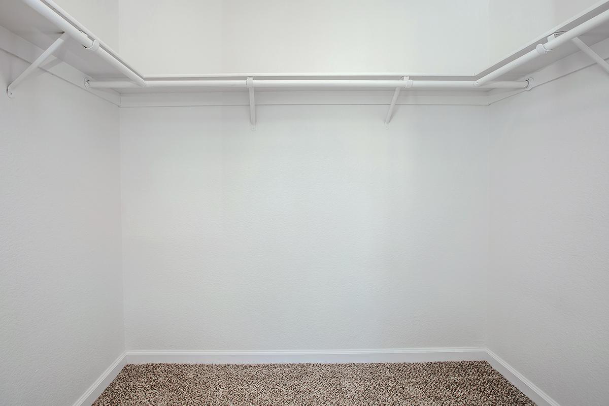 a white tub sitting next to a shower