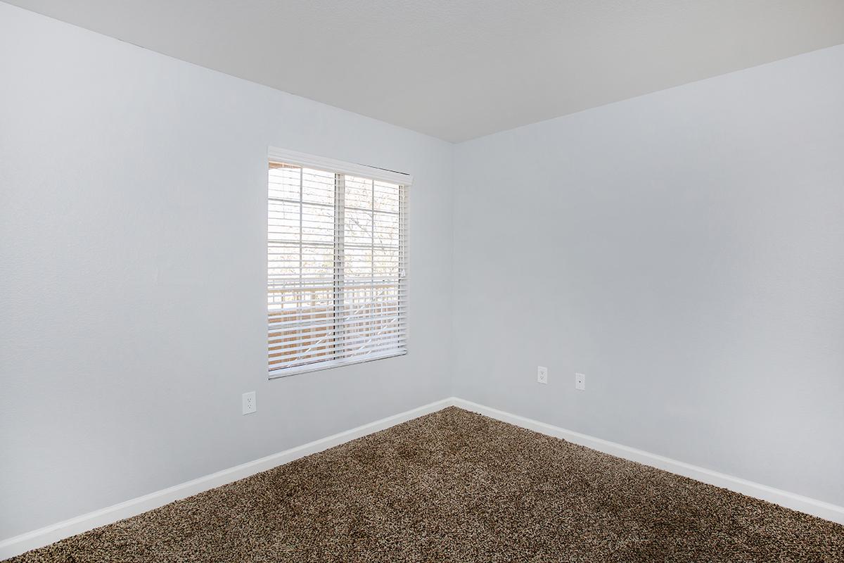 a large white tub next to a window