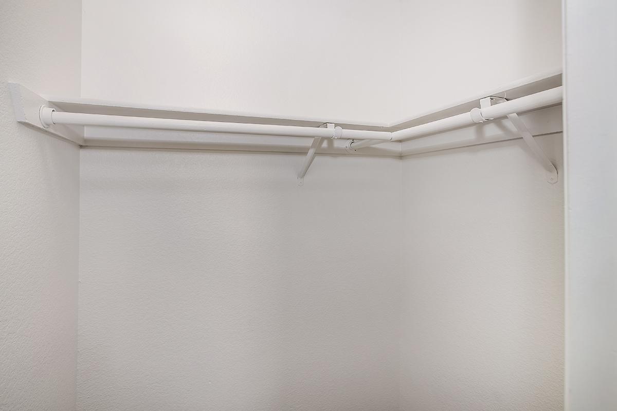 a white tub sitting next to a shower curtain