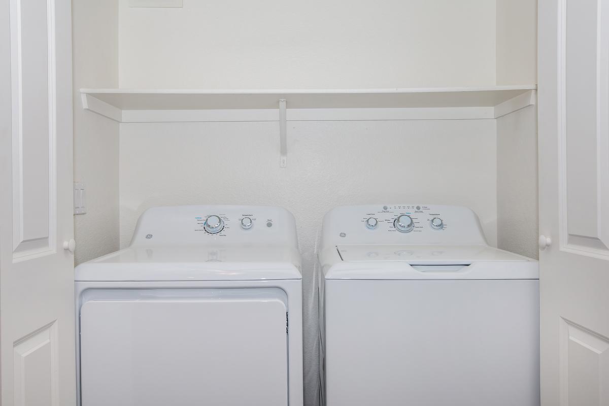 a white refrigerator freezer sitting inside of a kitchen