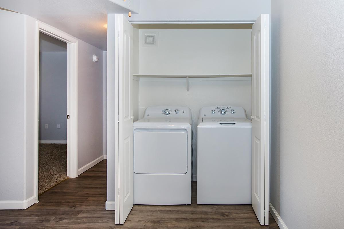 a white refrigerator freezer sitting next to a door