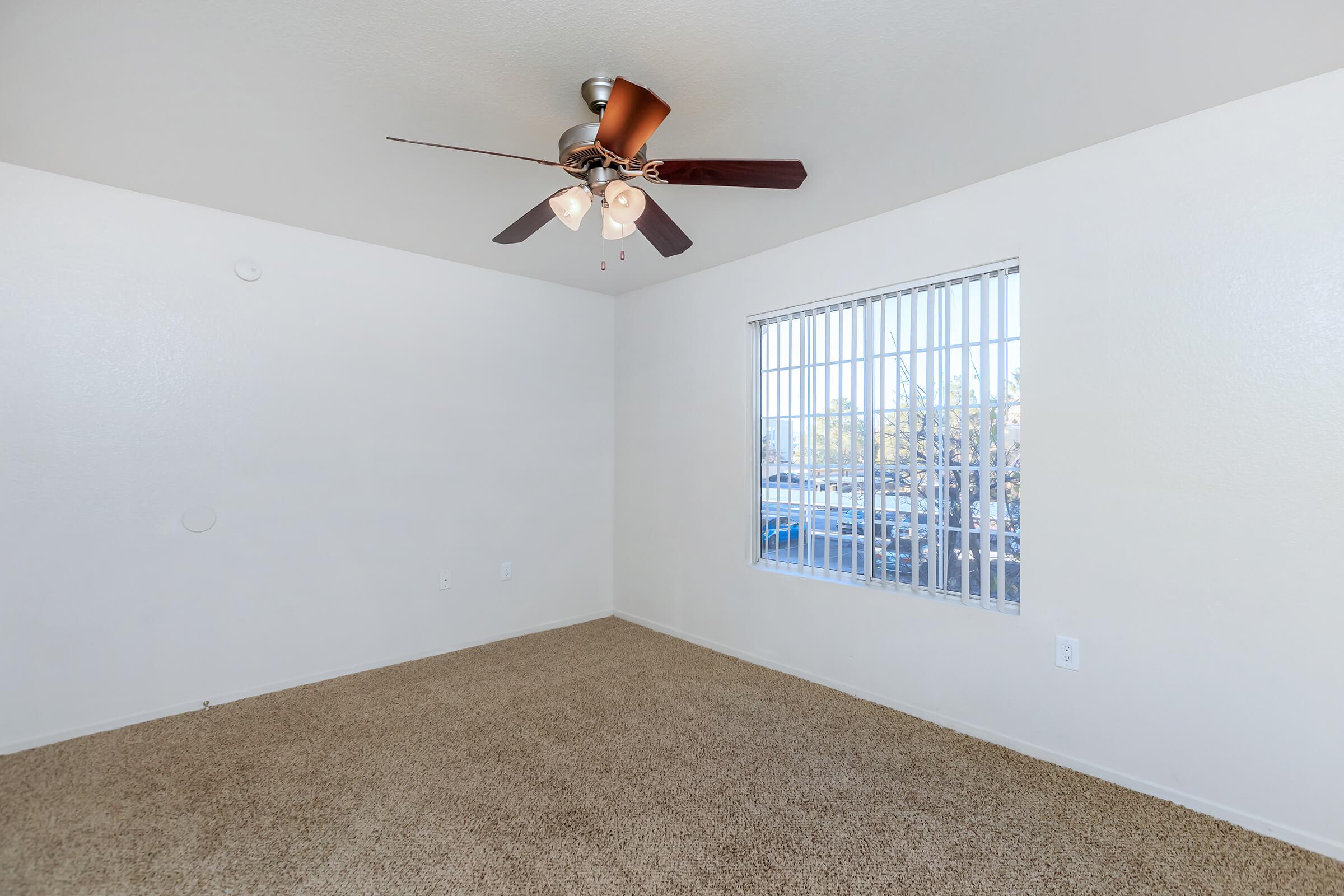 a bedroom with a large window