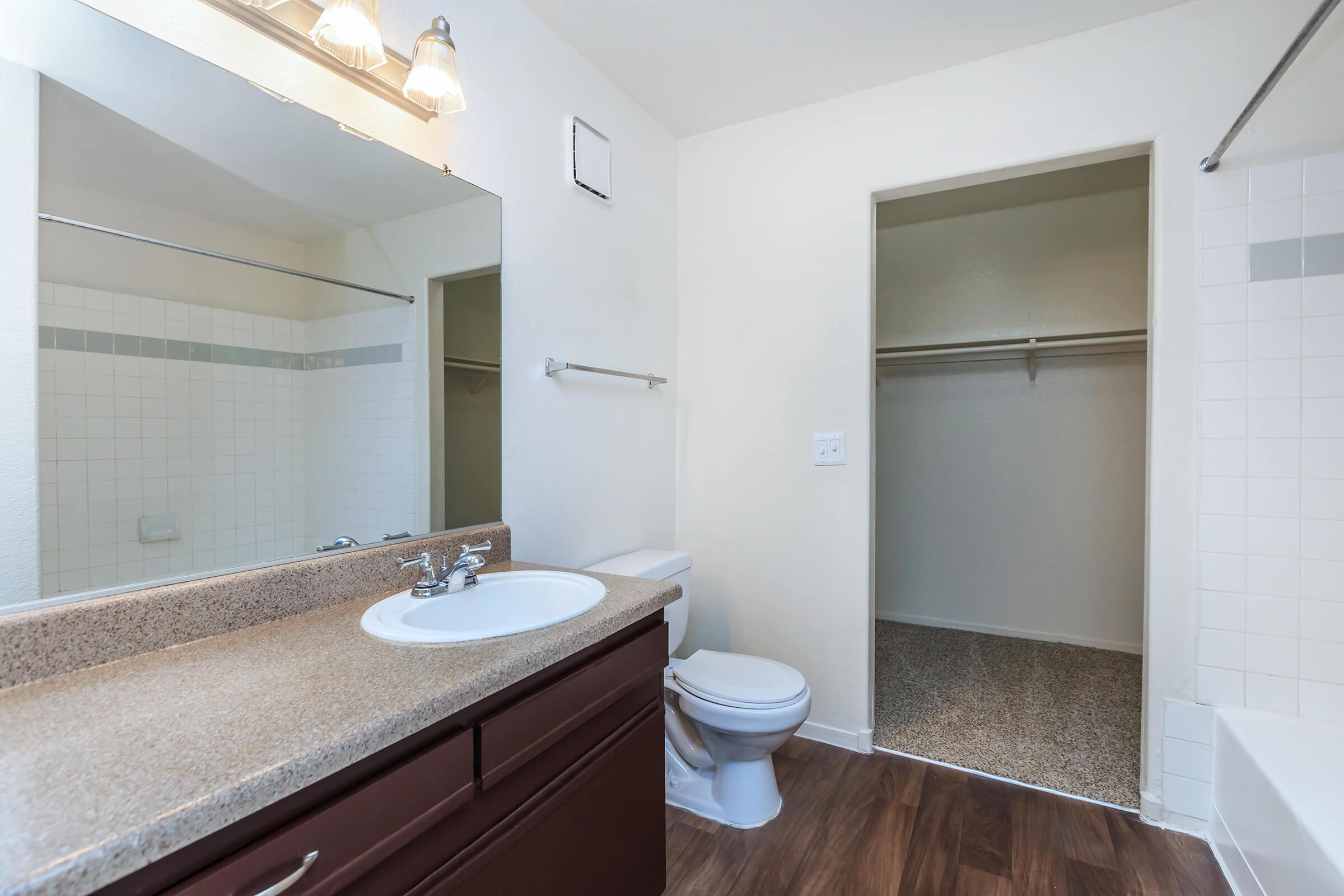 a room with a sink and a mirror