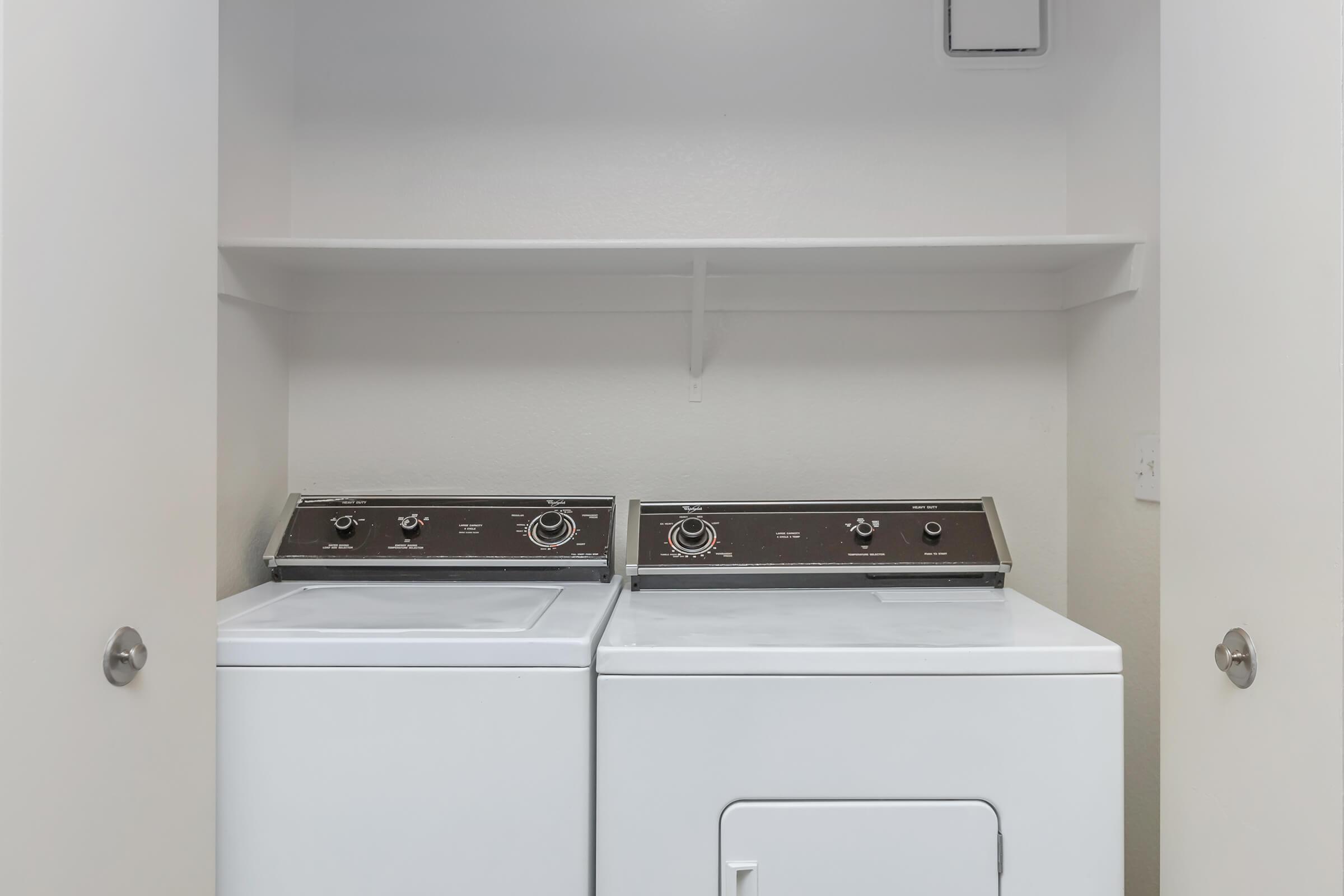 a white stove top oven sitting inside of a kitchen