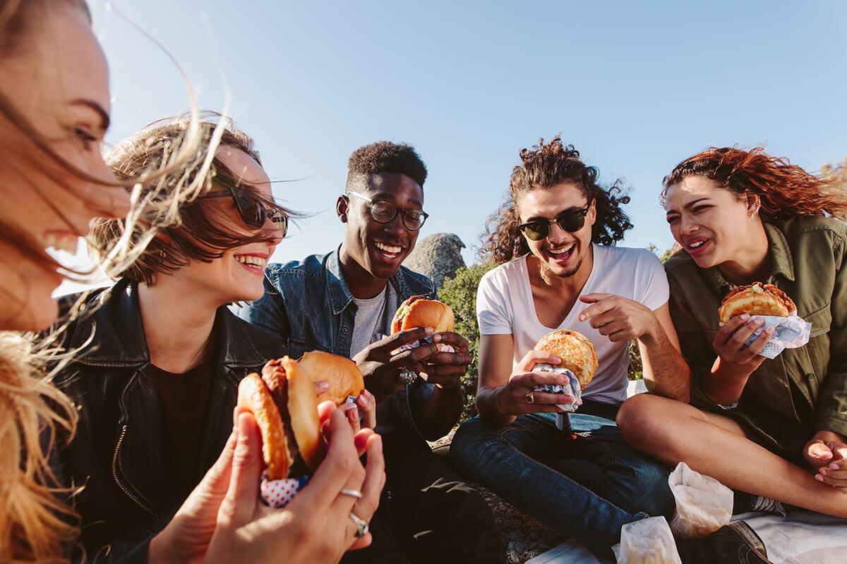 a woman eating a hot dog