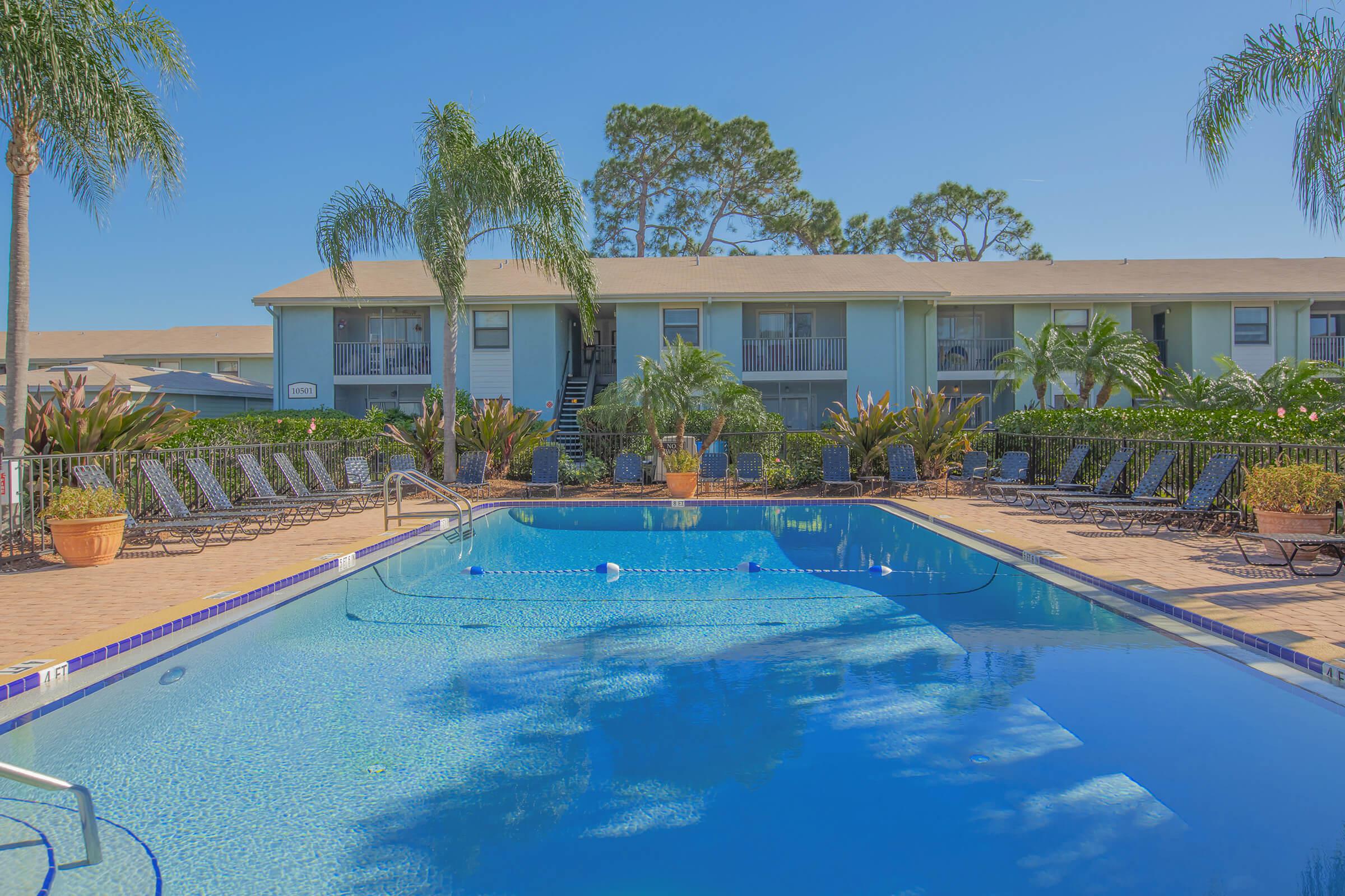 SOAK UP THE SUN BY THE SHIMMERING SWIMMING POOL