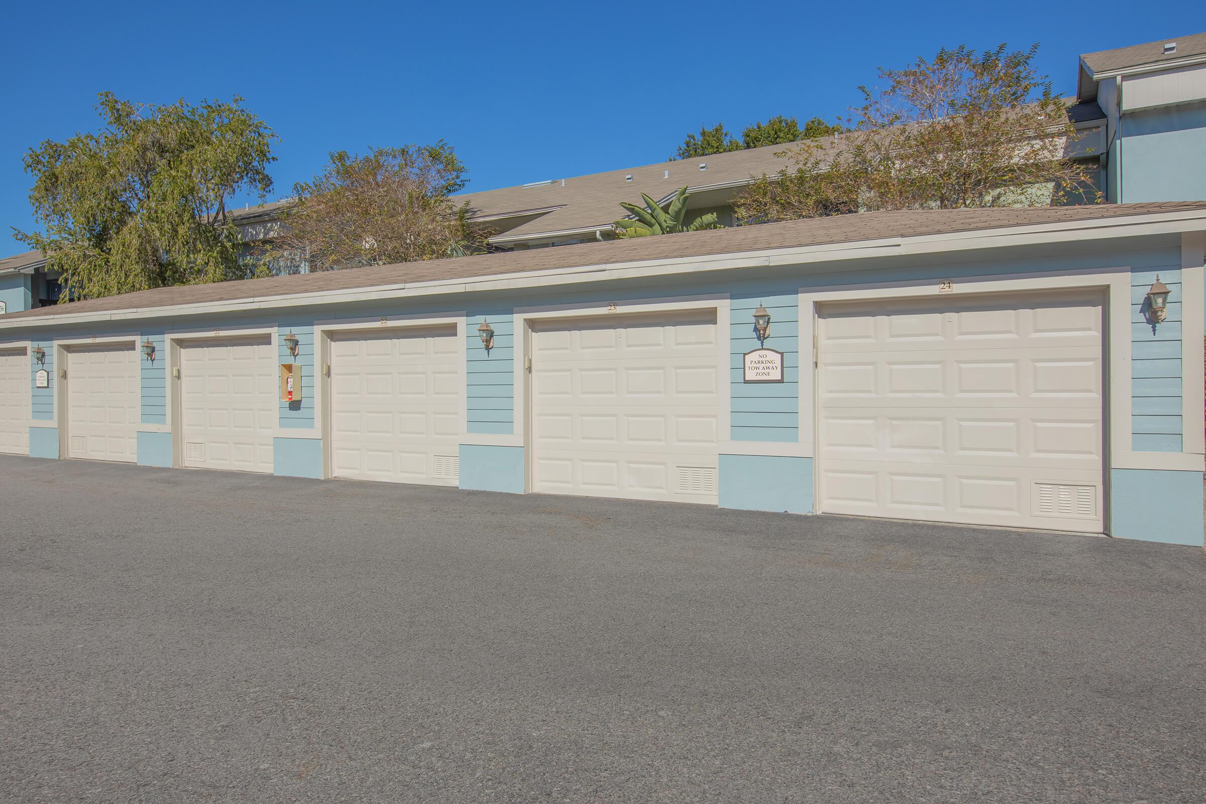 an empty parking lot in front of a house