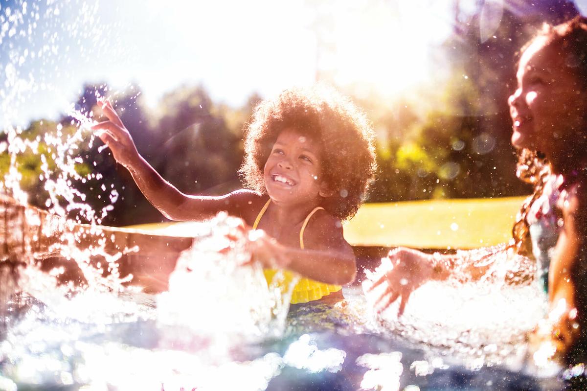 a girl riding a wave