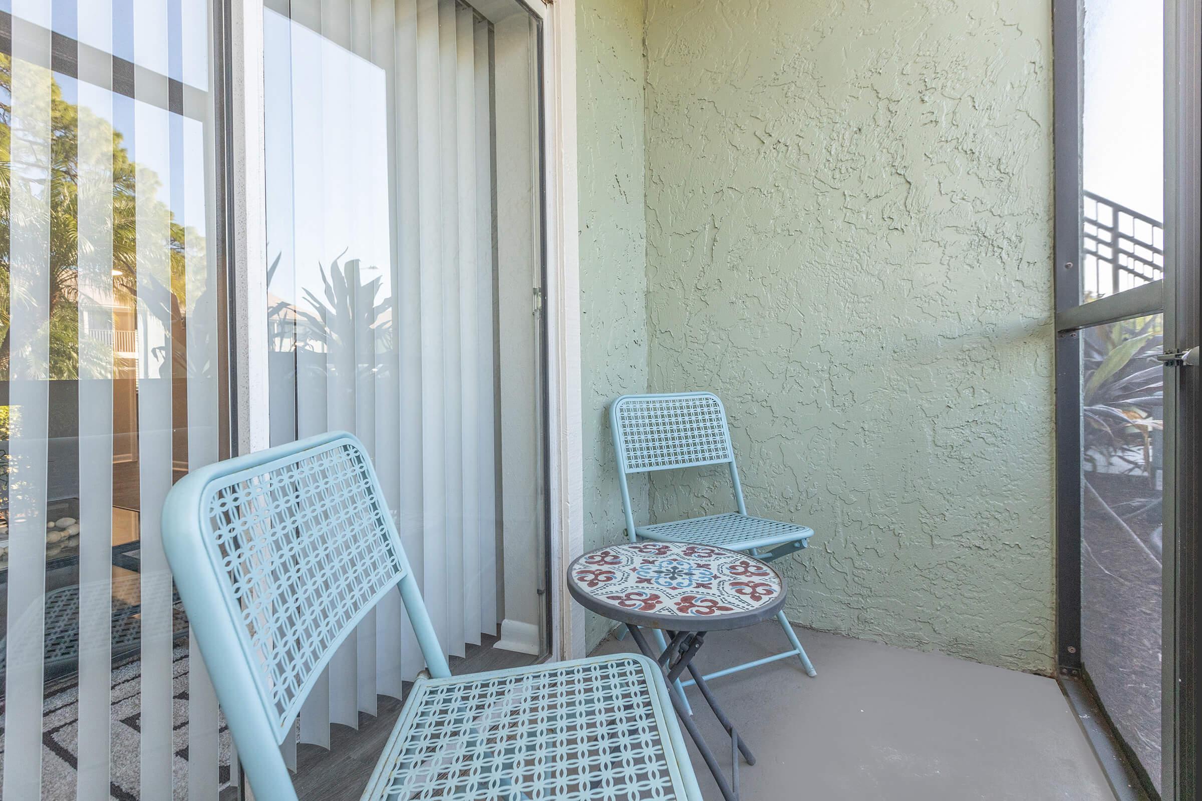 a chair sitting in front of a window