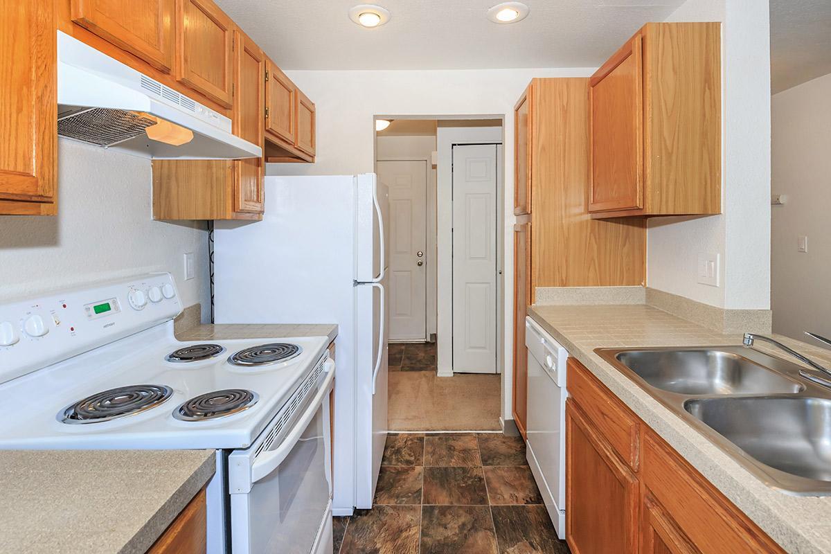 a kitchen with a stove oven and refrigerator